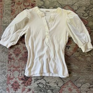 White puffy sleeved blouse.